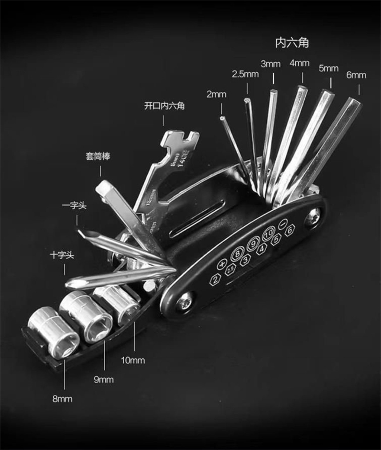 Seller component photograph of the opened black folding multitool showing hex keys, sockets, screwdrivers, extension bar and wrench plate.